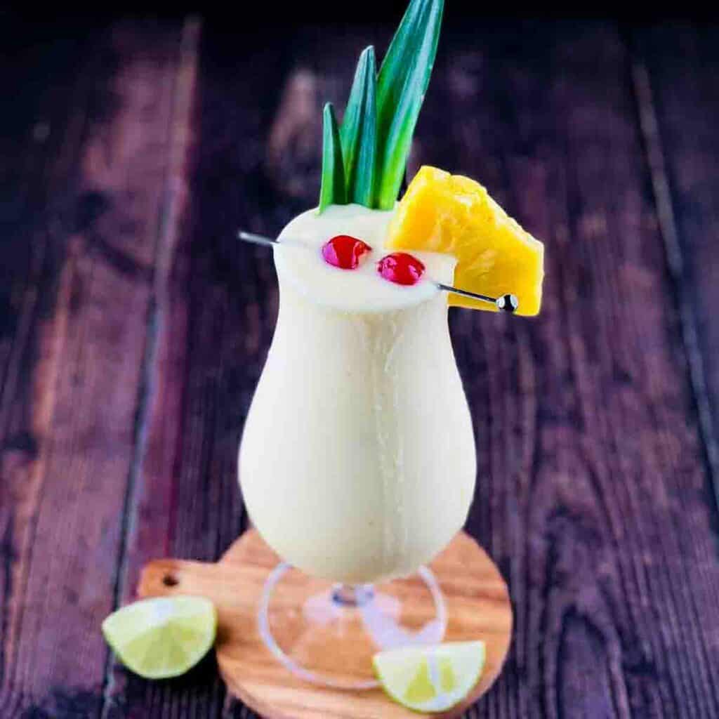 A hurricane glass filled with frozen Bacardi pina-colada
