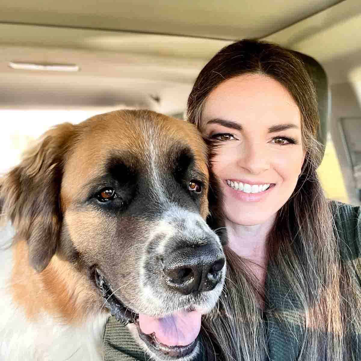 Jeri in her vehicle with her Saint Bernard dog, Bruno.