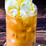 Delicious caramel iced coffee topped with whipped cream and caramel drizzle.